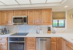 The remodeled kitchen features stove, oven, fridge/freezer, microwave and dishwasher